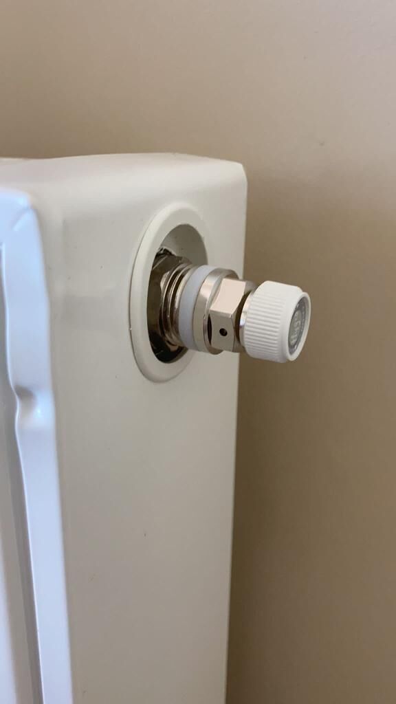 CALEFFI 1/2 inch hygroscopic automatic air vent fitted on a radiator
